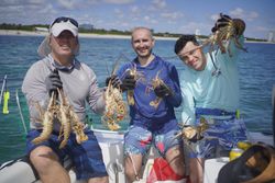 Four people enjoying a fishing tour in Sarasota
