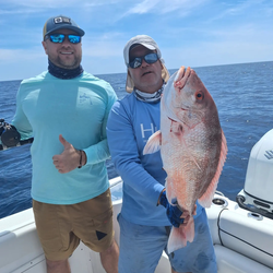 Two people enjoying a fishing tour in Sarasota