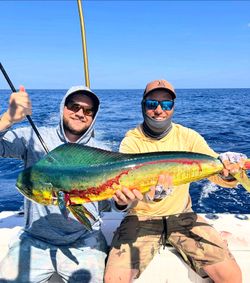 Two people enjoying a fishing cruise at New Smyrna Beach