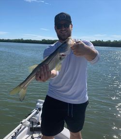Angler landing a 19-inch fish in Florida