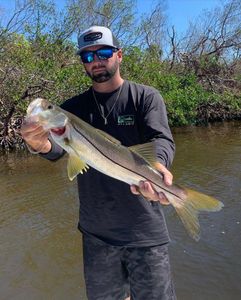 Two anglers with a big fish caught in Fort Myers