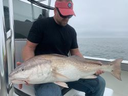 A person fishing at New Smyrna Beach