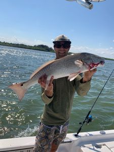 A person fishing at New Smyrna Beach