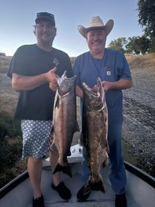 Two anglers holding their catch at Arbuckle