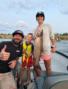 Angler catches Chinook Salmon while fishing in CA