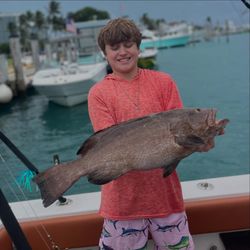 Angler holding a 25-inch fish in Miami, Florida
