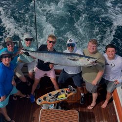 A group of people fishing for wahoo fish in Florida