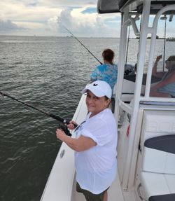 A person enjoying a fishing cruise in AL