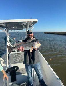 Impressive 26-inch redfish caught during a cruises, fishing, tours adventure in AL