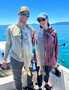 Two lake trout measuring 23 inches caught while fishing at Breezy Point