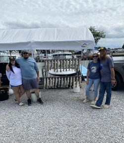 Four people fishing at Port Clinton