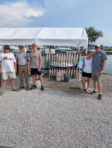 5 people enjoying fishing in Port Clinton