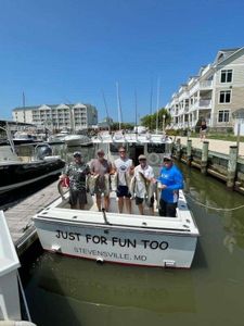 4 people enjoying a great fishing trip in Grasonville