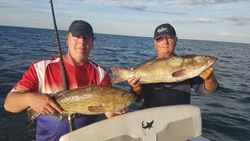 Two anglers with big 19-inch fish caught while fishing in FL