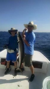 A pair of anglers holding a 38-inch fish in FL