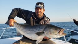 1 fisherman enjoying a great catch in MA
