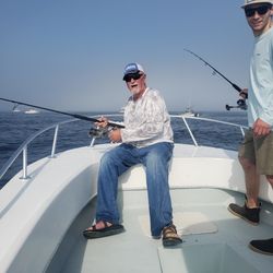 Two people enjoying a fishing trip in MA