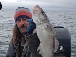 Angler with a 17-inch fish caught in MA