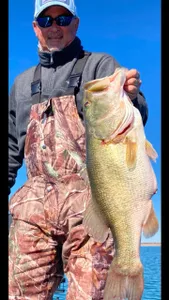 A person fishing in Texas with a 27-inch catch