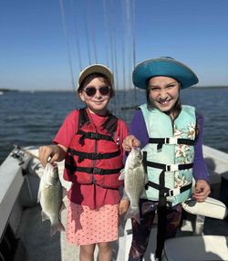 Two anglers fishing for white bass in Pottsboro