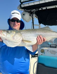 Fisherman catching a 28-inch fish in Cleburne
