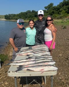 Four people fishing in Pottsboro