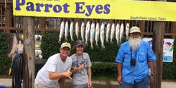 Three people fishing at Port Isabel