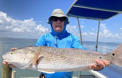 Angler catches a redfish in Port Isabel