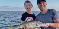 Snook fish caught by two people in Weeki Wachee