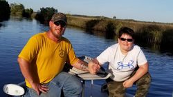 Three people enjoying a fishing trip at Weeki Wachee