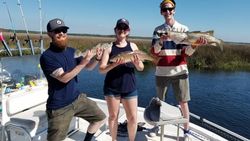Anglers fishing with poles on the coast of Florida