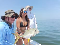 Three people enjoying a fishing trip at Weeki Wachee