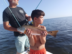 Redfish action awaits at Bayport Park under clear skies!