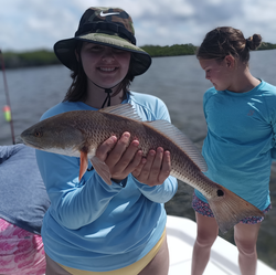 Partly cloudy skies set the stage for an epic redfish battle!