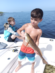 Reeling in the best fishing experience with a redfish catch in Weeki Wachee!