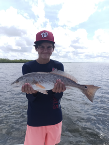 Hooked a redfish in Weeki Wachee's stormy skies!