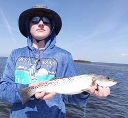 Reeled in a nice catch on a peaceful day by the water.