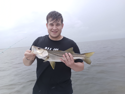 Cloudy skies can't dampen the thrill of snook fishing in Weeki Wachee!