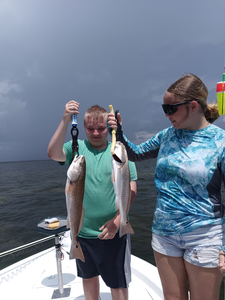Huge redfish double-header in Weeki Wachee's stormy afternoon!