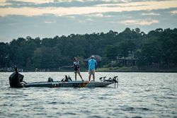 Bass boat on lake in Fort Worth TX with anglers fishing