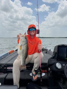 Bass fishing catch on boat in Fort Worth TX with fishing rod and equipment visible