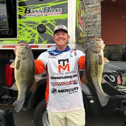 Two large bass fish displayed after successful fishing trip in Fort Worth TX