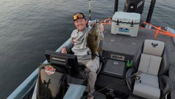 Smallmouth bass fishing success on boat with electronics and cooler in Fort Worth TX