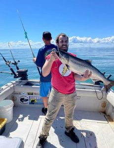 Chinook Salmon being caught on fishing trip in NY