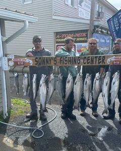 A group of 4 people fishing 10 great barracudas measuring 26 inches in New York