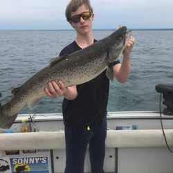 A fisherman with a 27-inch catch in NY