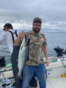Angler holding a 24-inch fish in Pulaski