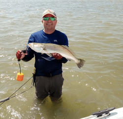 A single person fishing in the waters of Port O'Connor