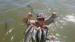 A person fishing in the waters of Port O'Connor