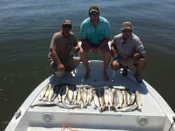 Three people fishing at Port O'Connor